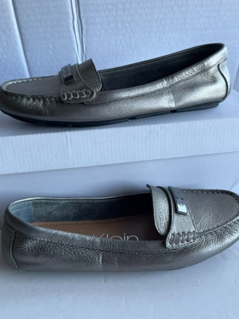 Calvin Klein Leta silver metallic leather loafer.